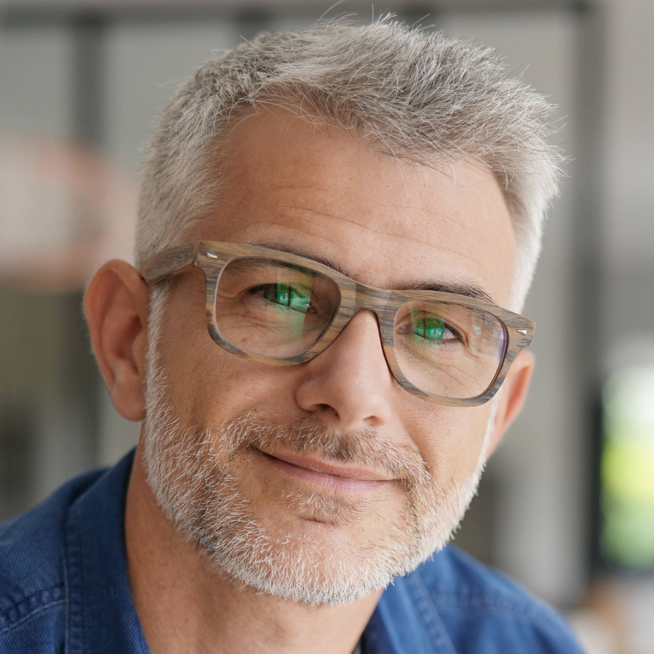 Smiling middle aged man with glasses