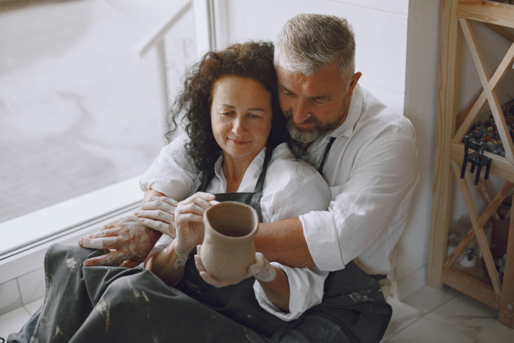 Adult senior couple at artwork in pottery • Experience Hope Counseling couple making time for each other