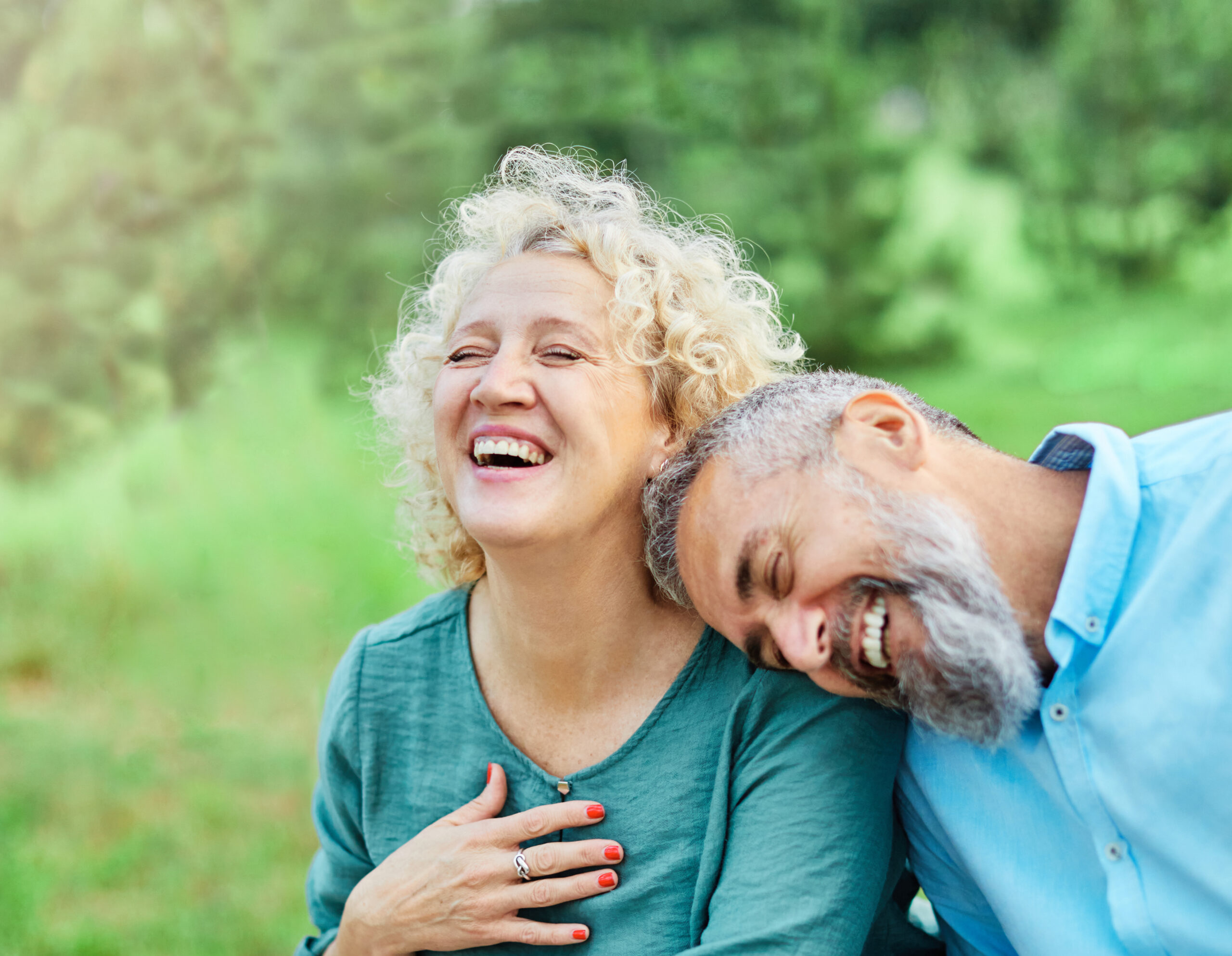 Couple laughing together outdoors
